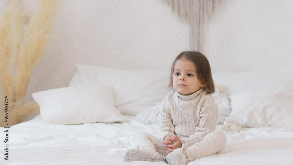 Child is sad and sick on the bed at home. Concept of a bad mood. Child is sad and sick on the bed at home. Concept of a bad mood.