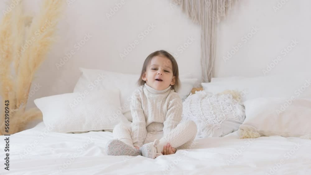 The child laughs and plays. The girl is having fun at home. Concept of happiness. The child laughs and plays. The girl is having fun at home. Concept of happiness.