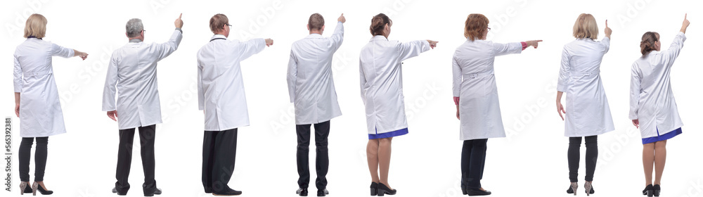 group of doctors standing with their backs isolated group of doctors standing with their backs isolated
