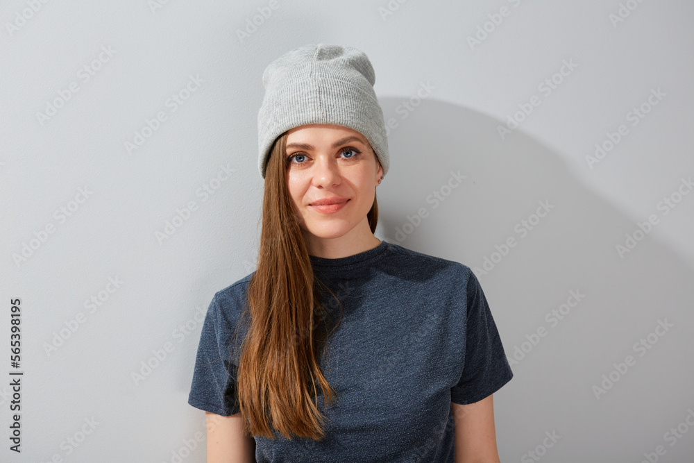 Smiling young woman in beanie hat isolated portrait. Smiling young woman in beanie hat isolated portrait.