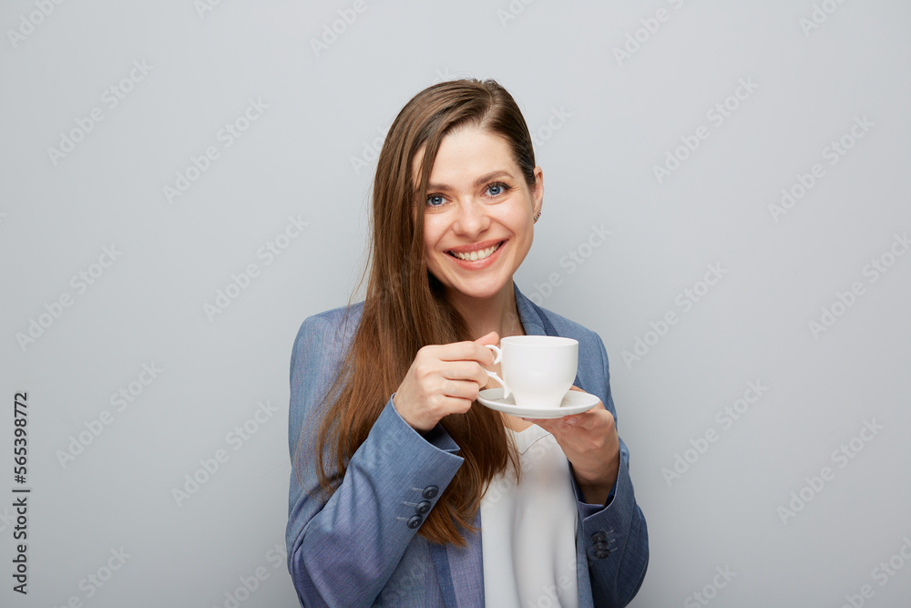 Business woman wearing suit drinking coffee. Business woman wearing suit drinking coffee.