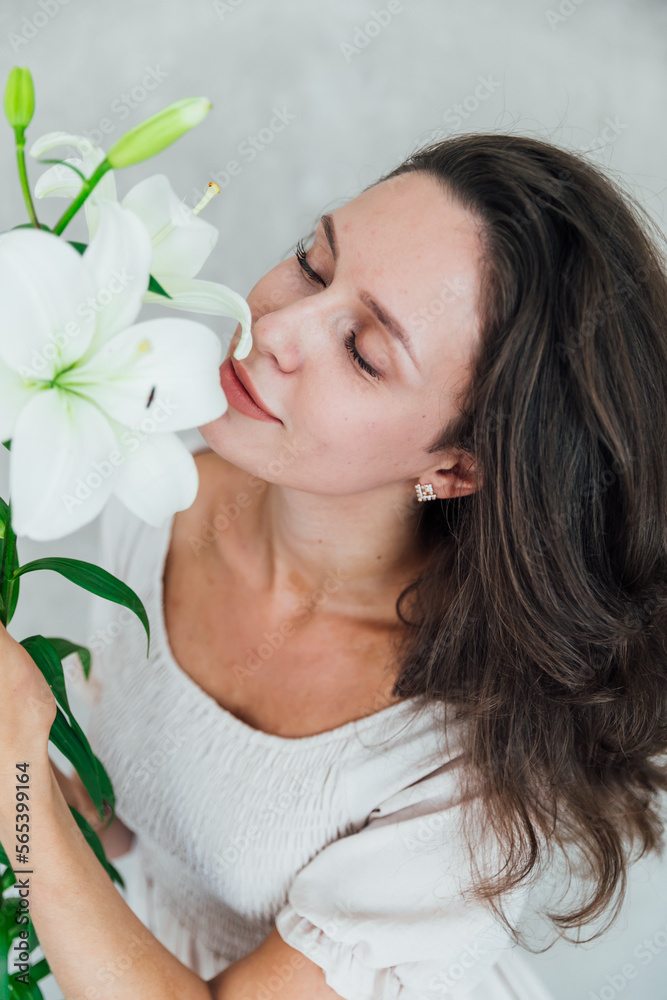 brunette woman in white dress with white flowers brunette woman in white dress with white flowers