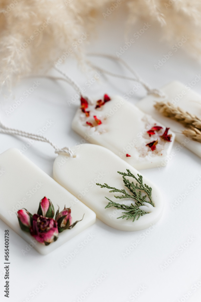 Aroma sachet with dried flowers with coconut or organic soy wax. Close up on white background Aroma sachet with dried flowers with coconut or organic soy wax. Close up on white background