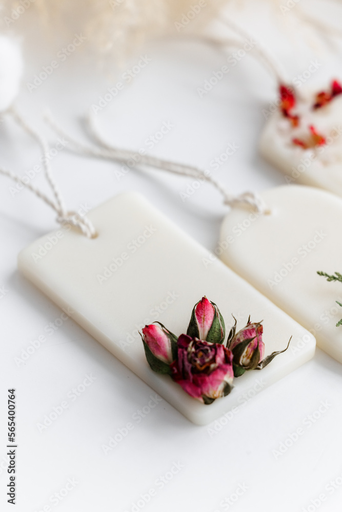 Aroma sachet with dried flowers with coconut or organic soy wax. Close up on white background Aroma sachet with dried flowers with coconut or organic soy wax. Close up on white background