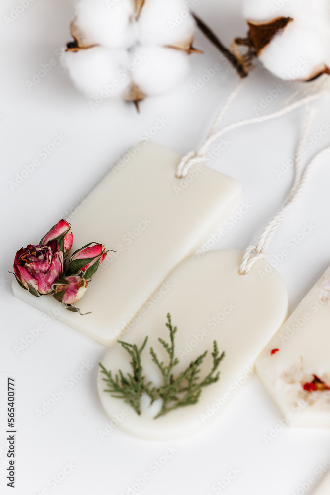 Aroma sachet with dried flowers with coconut or organic soy wax. Close up on white background Aroma sachet with dried flowers with coconut or organic soy wax. Close up on white background