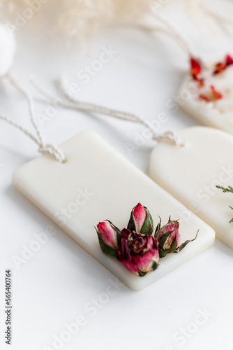 Fototapeta Naklejka Na Ścianę i Meble -  Aroma sachet with dried flowers with coconut or organic soy wax. Close up on white background