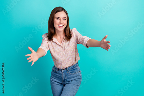Photo of adorable cheerful girl dressed pink shirt smiling open arms ready hug you isolated teal color background