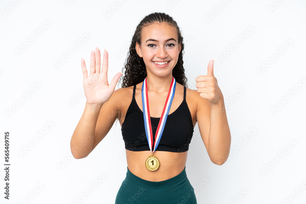 Young sport woman with medals isolated on white background counting six with fingers Young sport woman with medals isolated on white background counting six with fingers