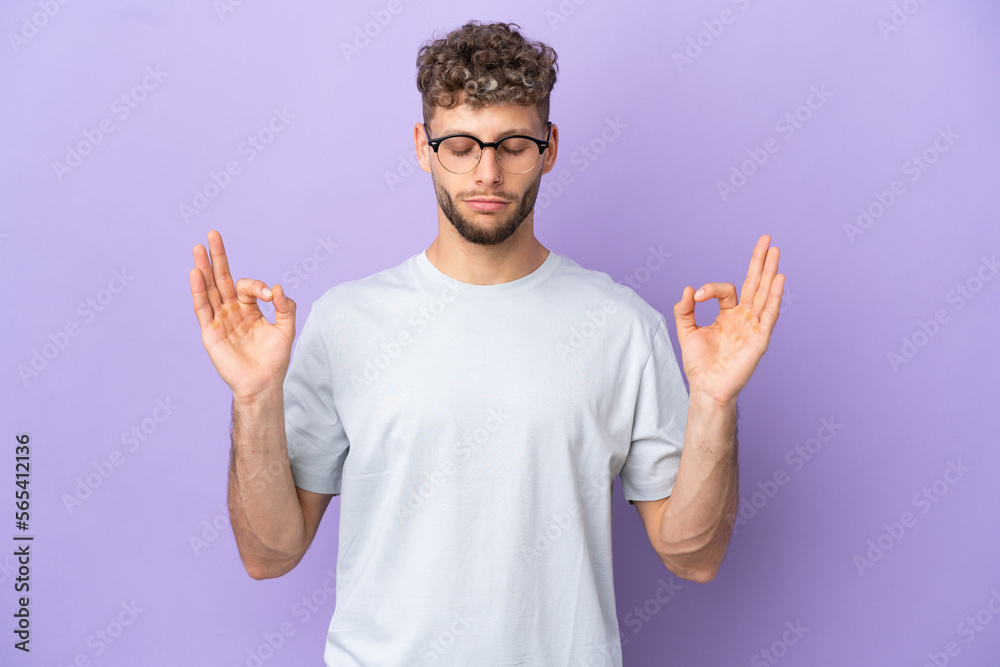 Delivery caucasian man isolated on purple background in zen pose