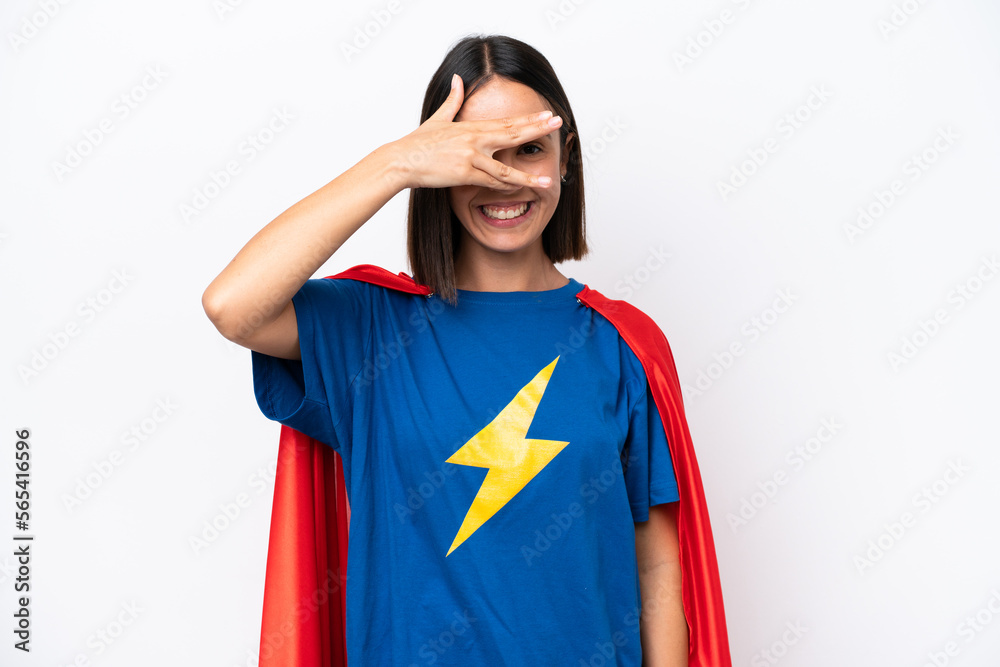 Super Hero caucasian woman isolated on white background covering eyes by hands and smiling Super Hero caucasian woman isolated on white background covering eyes by hands and smiling