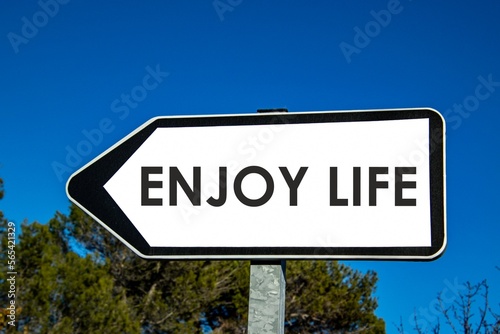 the words "enjoy life" written on a sign