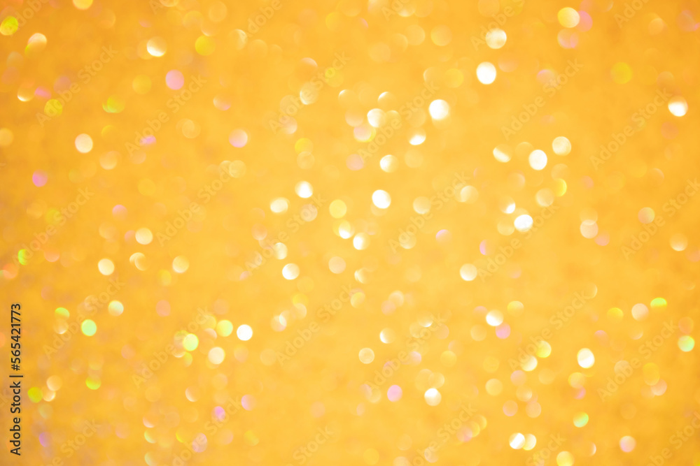 Shiny yellow blurred background for holiday design. Festival abstract sparkles, selective focus Shiny yellow blurred background for holiday design. Festival abstract sparkles, selective focus
