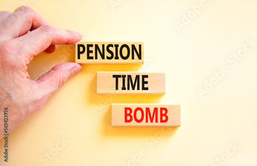 Pension time bomb symbol. Concept words Pension time bomb on wooden blocks on a beautiful white table white background. Businessman hand. Business pension time bomb concept. Copy space.