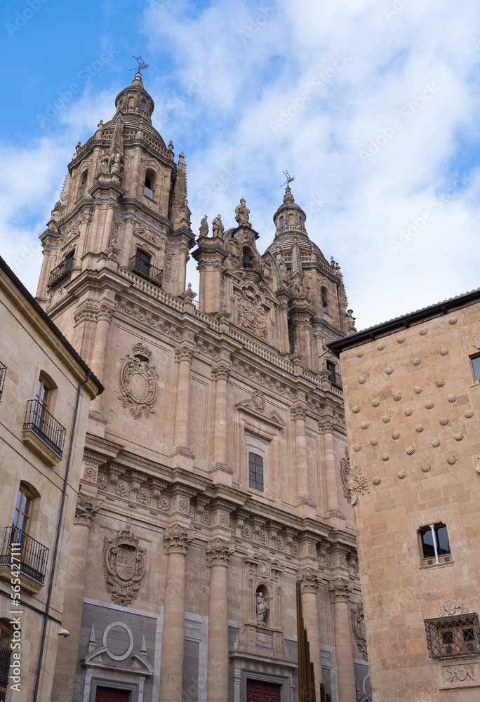 Building of the former Real Colegio del Espíritu Santo named La Clerecia in Salamanca (Castile and Leon, Spain). Historic building in baroque style. Church with an impressive facade of three bodies.
