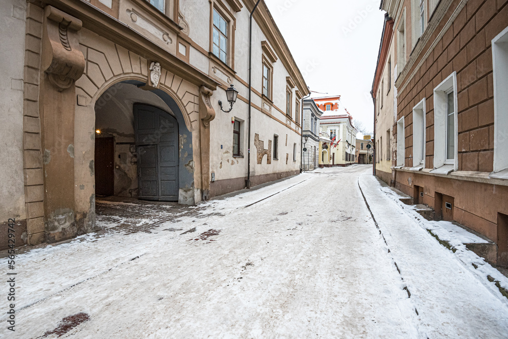 Winter view of the short, narow and winding historic Bernardinu street in Old Town of Vilnius, Lithuania
