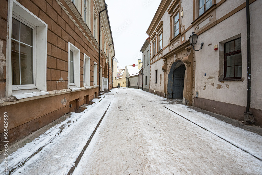 Winter view of the short,  narow and winding historic Bernardinu street in Old Town of Vilnius, Lithuania 