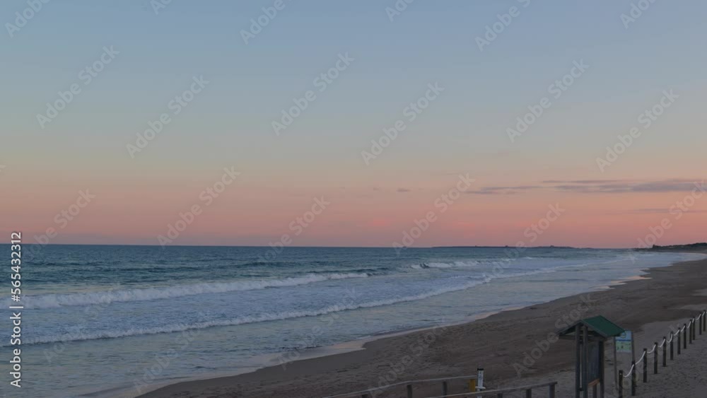 Beach landscape with hill and apartments at sunset Beach landscape with hill and apartments at sunset