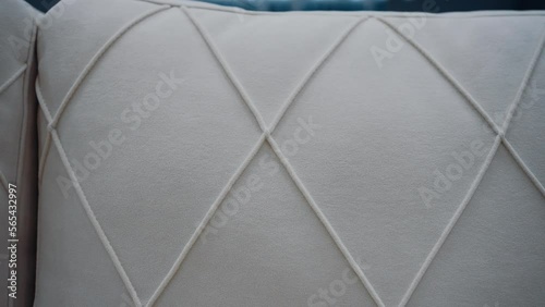 Close-up of a comfortable white sofa with diamond shapes. 4k video