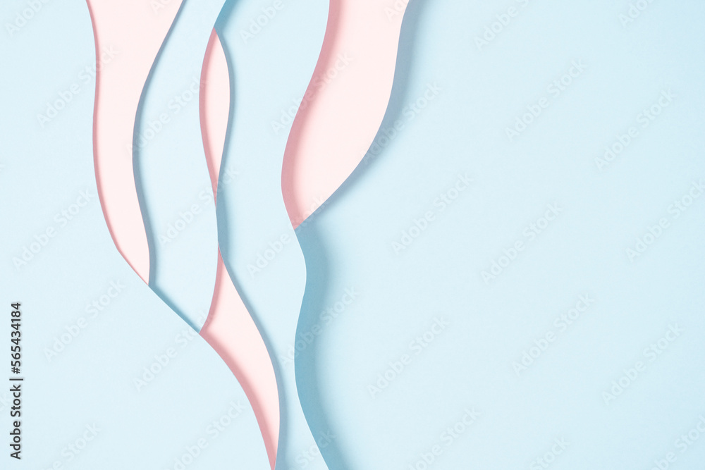Abstract colored paper texture background. Minimal paper cut composition with layers of geometric shapes and lines in pastel pink and light blue colors. Top view, copy space