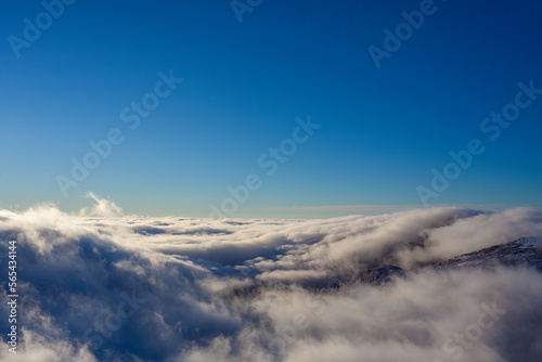 clouds and fog landscape with blue sky background © Ioan Panaite
