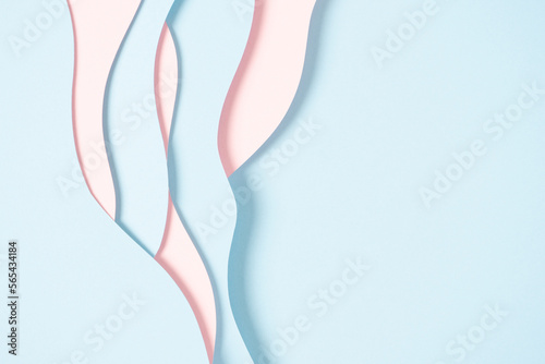 Fototapeta Naklejka Na Ścianę i Meble -  Abstract colored paper texture background. Minimal paper cut composition with layers of geometric shapes and lines in pastel pink and light blue colors. Top view, copy space