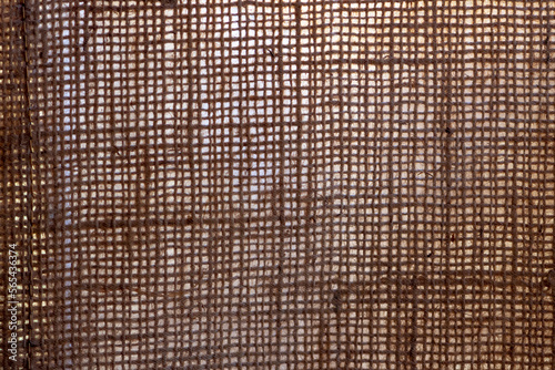 Texture Coarse linen fabric made of woven threads, close-up.