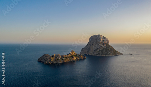 Es Vedra is an islet located on the island of Ibiza, calm blue sea and beautiful sky photo