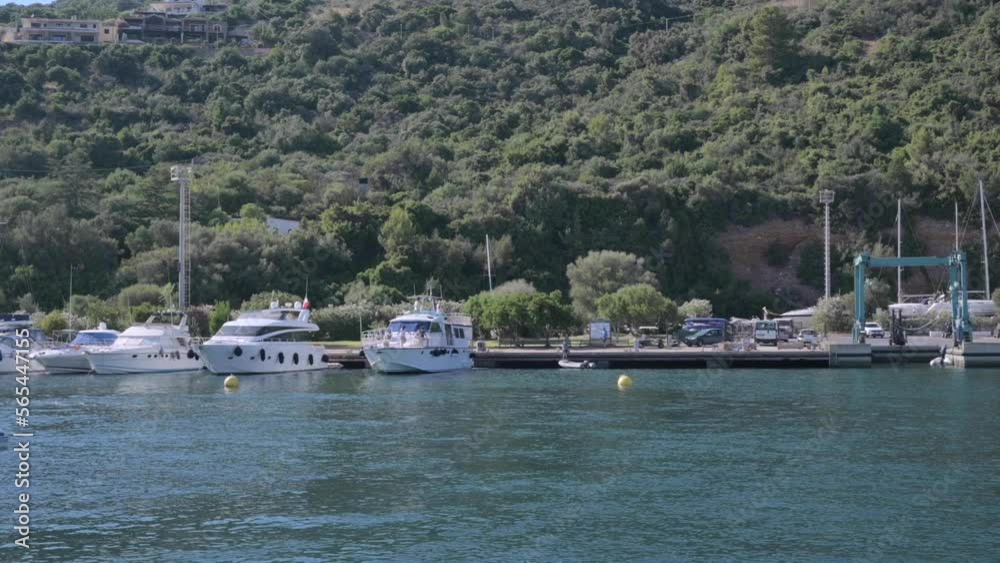 Small boat in the sea of sardinia. Luxury vacation. Embankment of Italy. travel on the waves. High quality 4k footage Small boat in the sea of sardinia. Luxury vacation. Embankment of Italy. travel on the waves. High quality 4k footage
