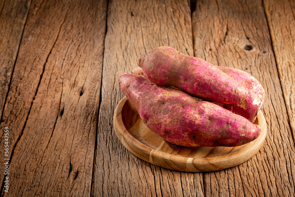 Raw sweet potato on the table.