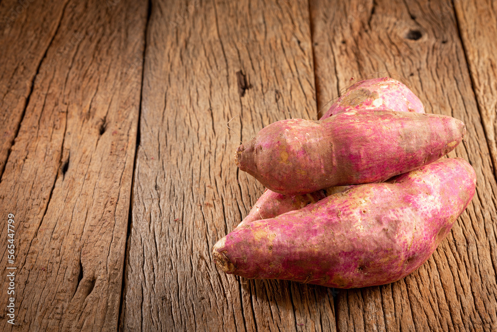 Raw sweet potato on the table.