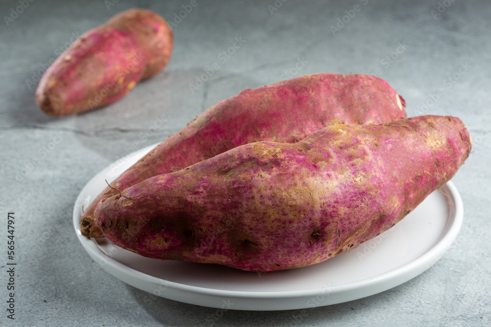 Raw sweet potato on the table. Raw sweet potato on the table.