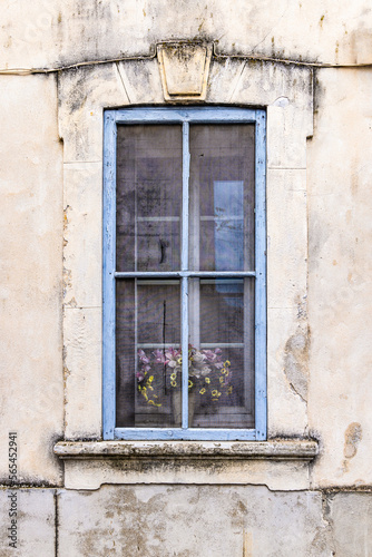A blue framed window on an old building. © Emily_M_Wilson