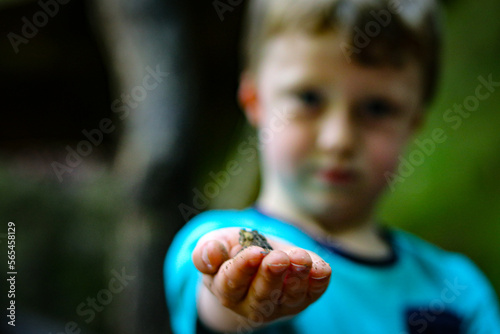 child holding toad