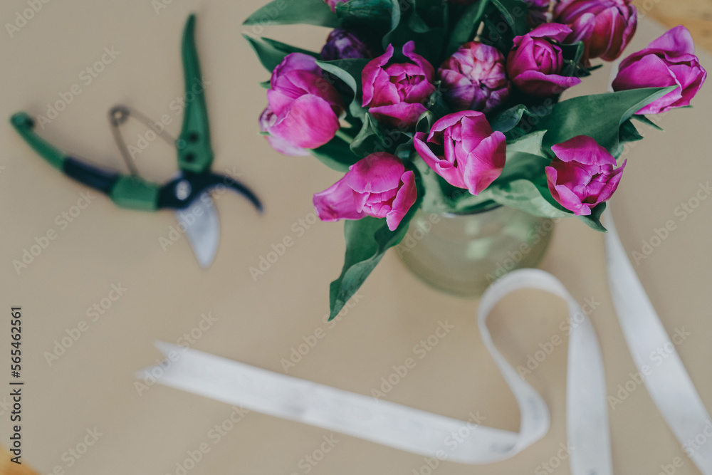 Fototapeta premium Close up tulips bouquet in a vase 8 March greeting