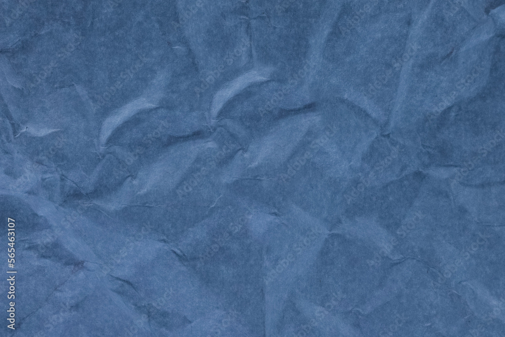 Fototapeta premium blue texture,a sheet of crumpled blue paper