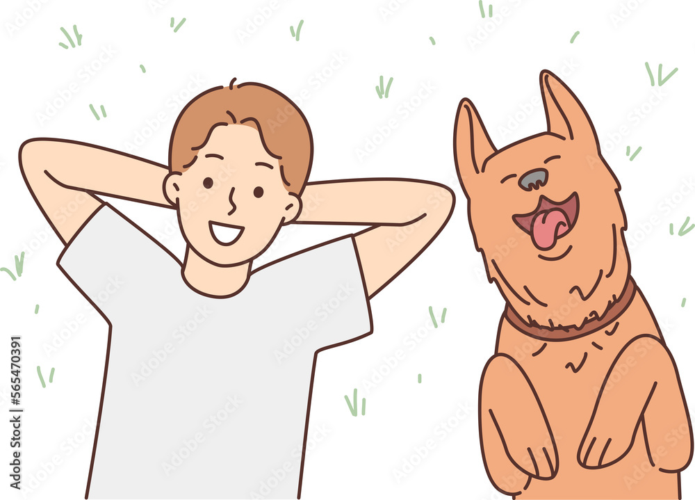 Smiling child lying on grass with dog Smiling child lying on grass with dog