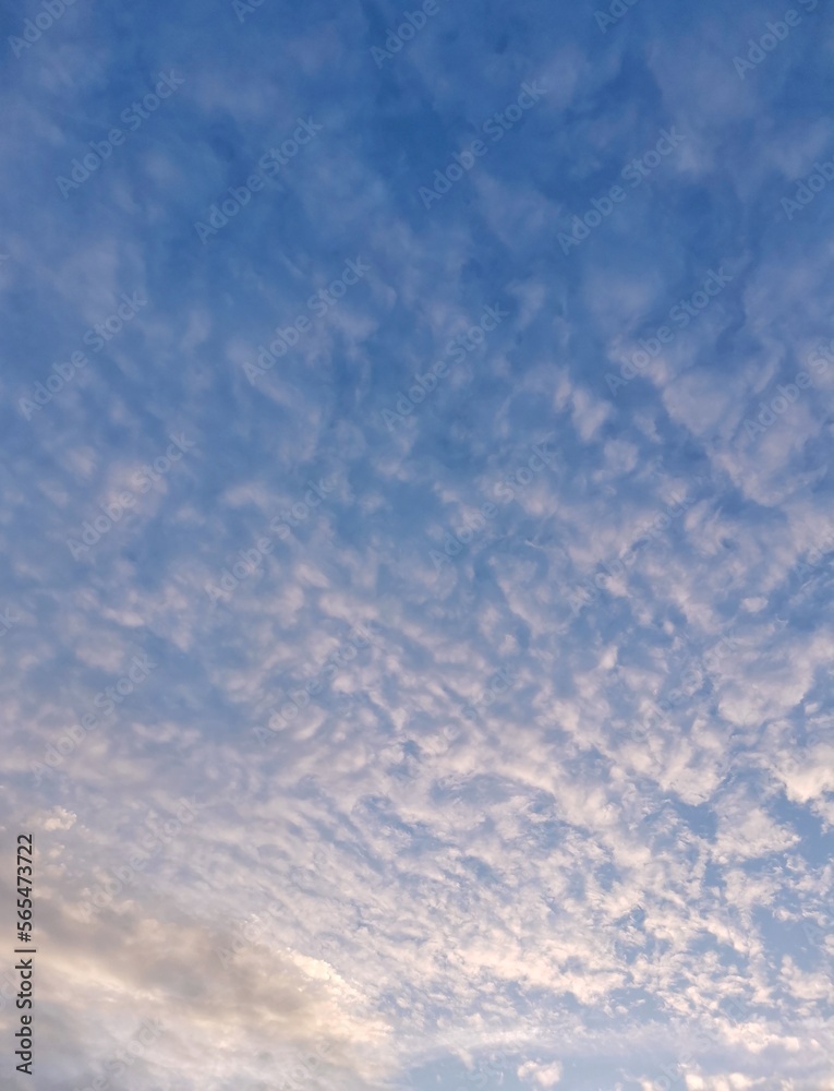 Beautiful vertical photo of clouds in blue sky