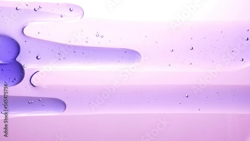 Slowly evolving transparent purple liquid abstract background.