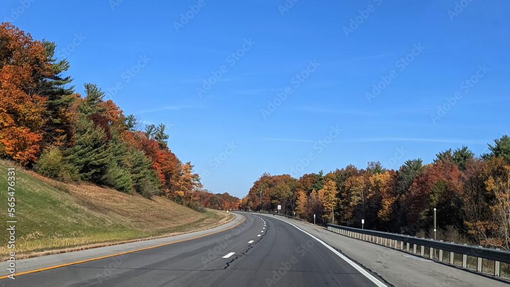 Winding highway with colorful foliage in the fall, Upstate NY, USA Winding highway with colorful foliage in the fall, Upstate NY, USA