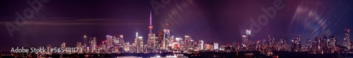 Wallpaper Mural Toronto skyline at night with buildings street lights. Toronto, Ontario, Canada. Down town city skyline and panorama with urban areas. Sky with lights leaks. Torontodigital.ca