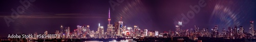 Toronto skyline at night with buildings street lights. Toronto  Ontario  Canada. Down town city skyline and panorama with urban areas. Sky with lights leaks.