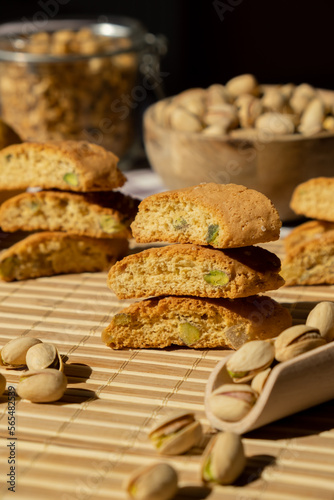 Biscotti Cantuccini Cookie Biscuits with pistachios and lemon peel Shortbread. Healthy eating food. Homemade fresh Italian cookies cantucci stacks and organic pistachios nuts. Vegan dieting vegetarian