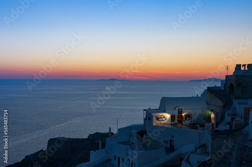 Twilight hour over Santorini, overlooking the caldera, under a dramatic sky, Oia Village, Greece