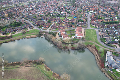 Aerial View of Residential Homes Near Tongwell Lake of Milton Keynes City of England Just Before Sunset. Drone's Camera Footage photo