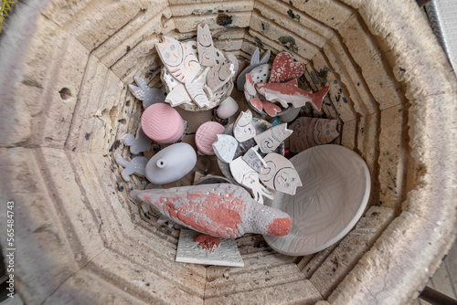 Looking down at Raku Ware loaded in an updraft kiln photo