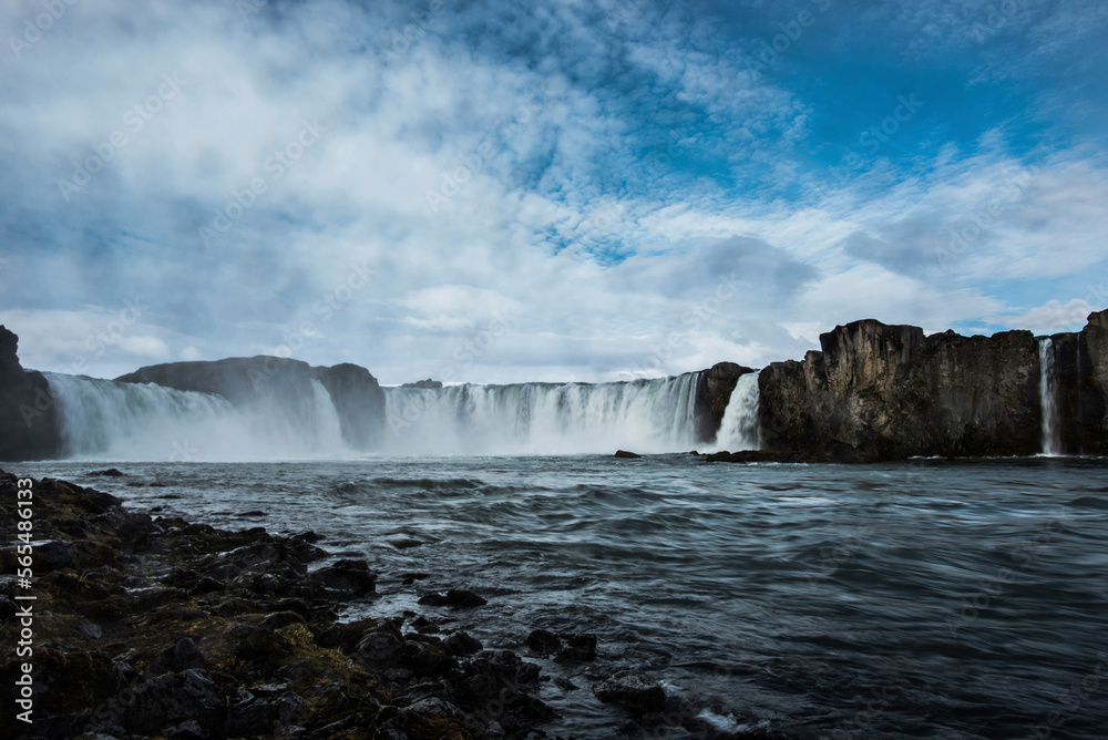 Scenic view of waterfall against sky