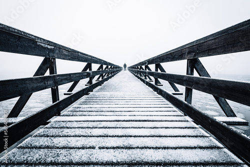 A wooden bridge in winter at Lindøya, Oslo.