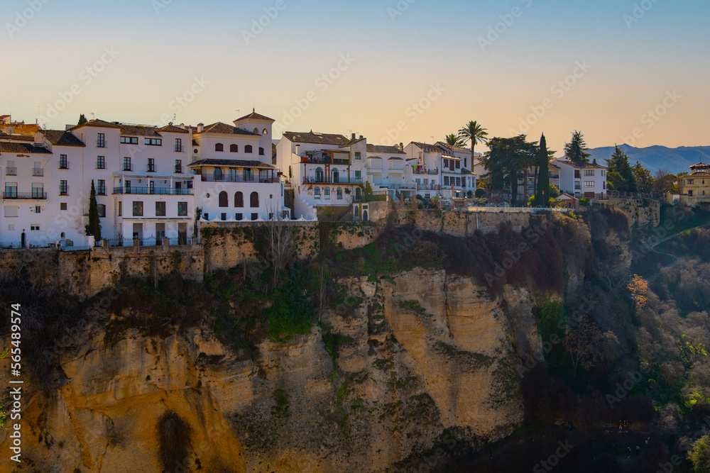 Houses built on the edge of the cliff, in the ancient city of Ronda, Spain Houses built on the edge of the cliff, in the ancient city of Ronda, Spain
