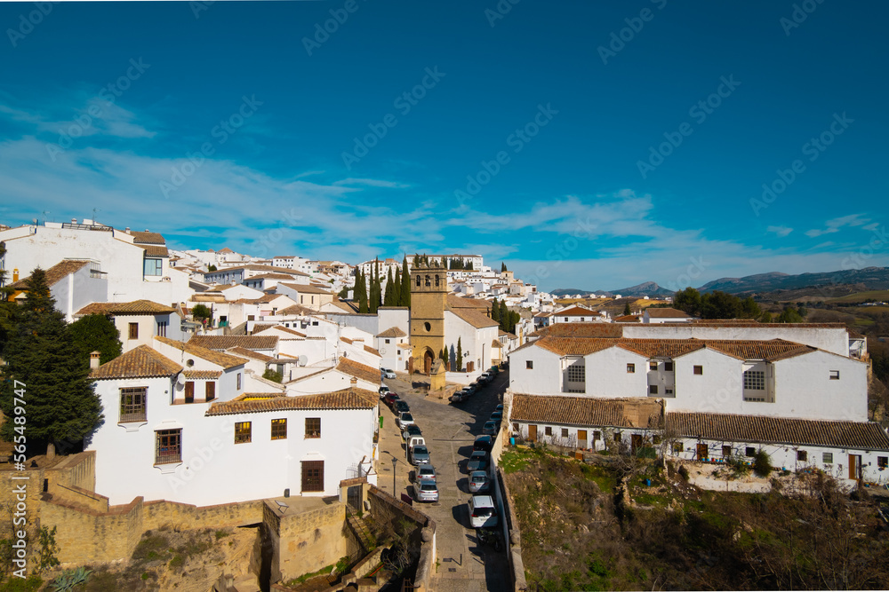 Beautiful aerial view of Ronda with bridge, church and houses