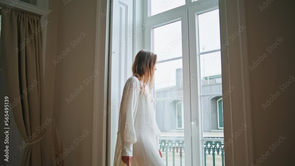 Young woman watching window home morning closeup. Relaxed girl enjoying weekend Young woman watching window home morning closeup. Relaxed girl enjoying weekend